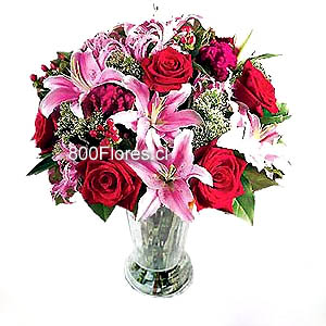 (AVAILABLE ONLY IN:Beijing, Shanghai, Guangzhou, Shenzhen, Nan Ning, Cheng Du)
Four pink lilies, six red roses, and pink carnations with green foliage in a glass vase.