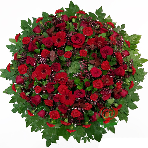 Impactante corona totalmente en flores rojas, compuesta de Rosas, Claveles y Flores mixtas de complemento al tono.  Sólo Santiago.  Seleccione color